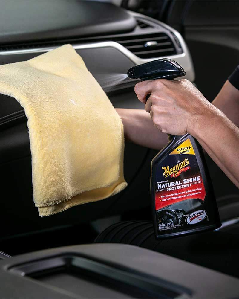 Images of meguiars natural shine protectant being used in the interior